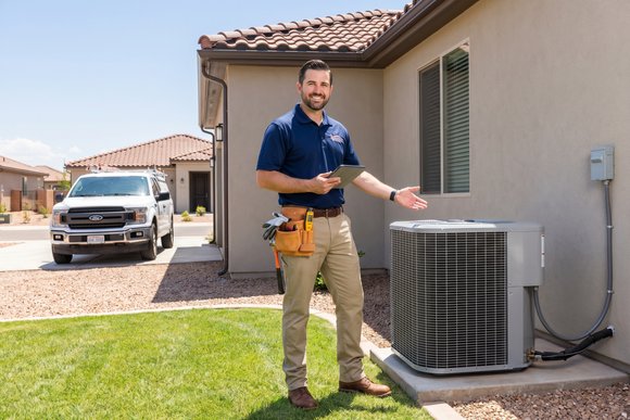 Field service professional reviewing an estimate on a tablet at a job site